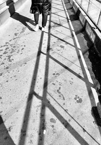 Low section of person walking on footpath