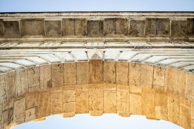 Low angle view of old building against clear sky