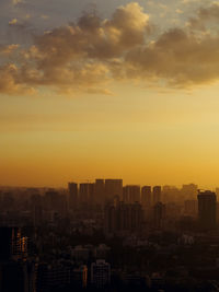 Cityscape against sky during sunset