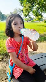 Girl sitting on field