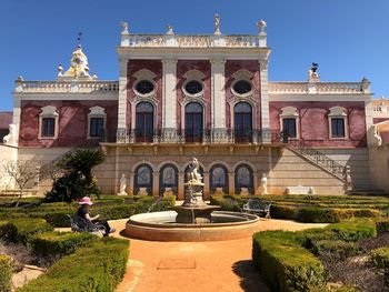 Facade of historic building against sky