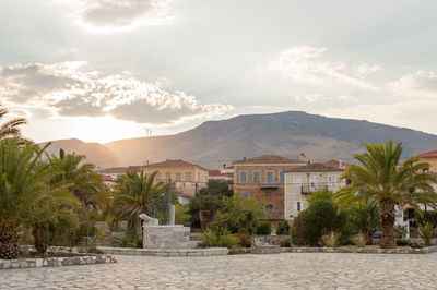 Trees and buildings against sky