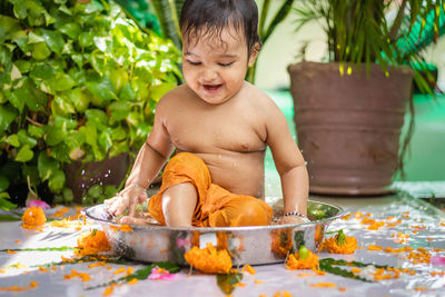 Portrait of boy sitting on table