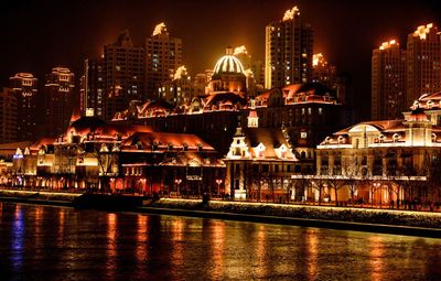 Illuminated buildings in city at night