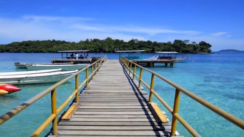 Scenic view of sea against blue sky