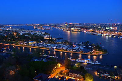 High angle view of illuminated buildings in city at night