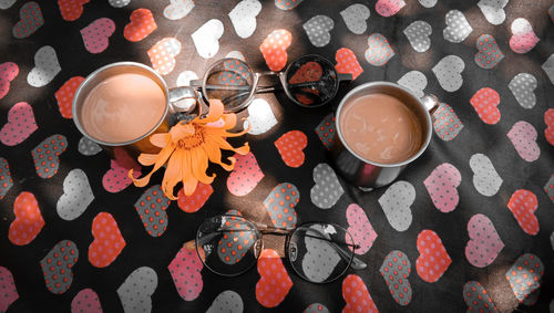 High angle view of tea with eyeglasses on table