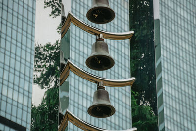 Low angle view of street light against building