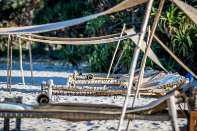 Close-up of camp beds on beach