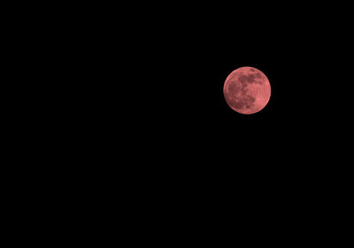 Low angle view of moon against sky at night