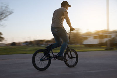 Portrait of teenage boy riding bike