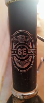 Close-up of text on glass table