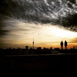 Silhouette of woman at sunset