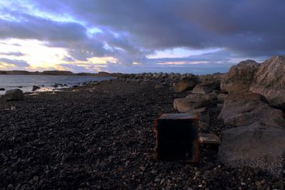 Scenic view of sea against cloudy sky