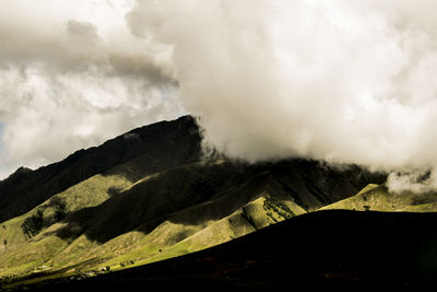 Scenic view of volcanic mountain against sky