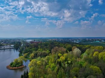 Scenic view of river and trees against sky