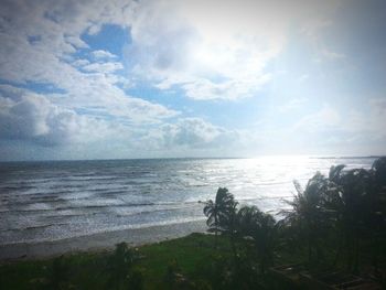 Scenic view of sea against cloudy sky