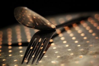 Close-up of metal on table