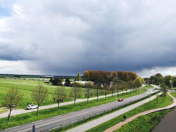 Scenic view of green landscape against sky