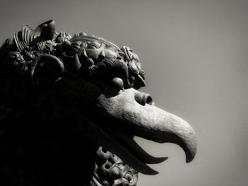 Low angle view of statue against sky