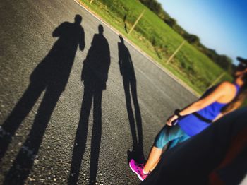 Low section of man shadow in park