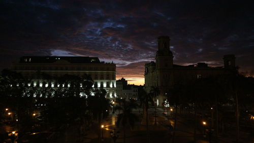 Illuminated buildings in city at night