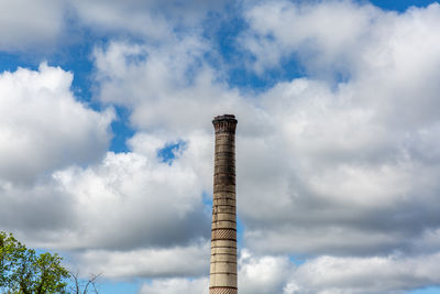 Low angle view of smoke stack against sky