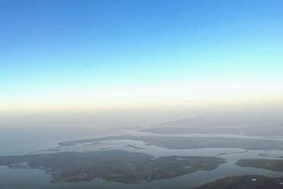 Aerial view of landscape against clear blue sky