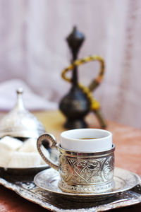 Turkish coffee and turkish sweets lokum on metal tray