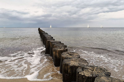 Pier over sea against sky