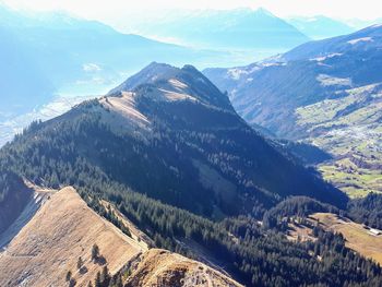 Aerial view of snowcapped mountains against sky