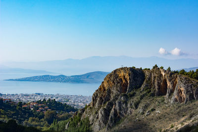 Scenic view of mountains against clear blue sky