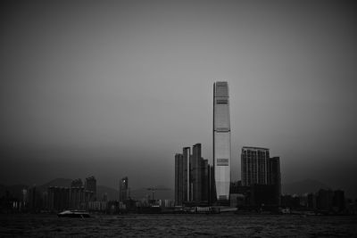 Modern buildings in city against clear sky