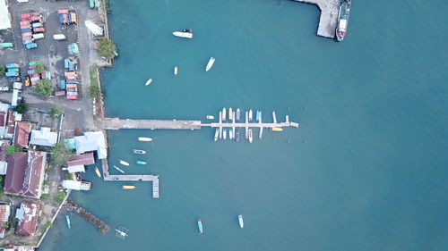 High angle view of boats moored in sea against sky