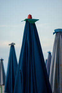 A lot of blue white sun umbrellas on a beach