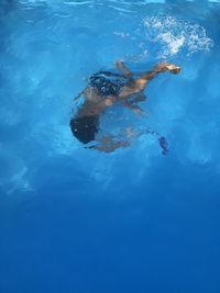 High angle view of a boy diving in pool