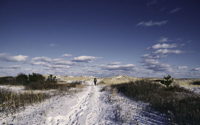 Scenic view of landscape against sky during winter