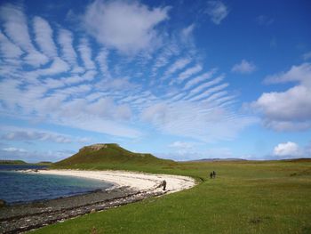 Scenic view of sea against cloudy sky