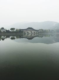 View of river with houses in background