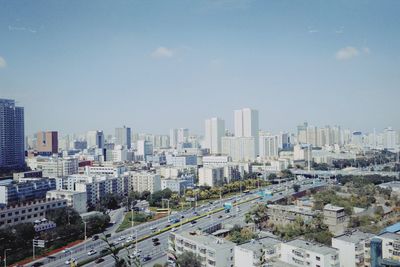 High angle view of buildings in city against sky