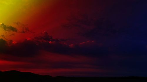 Low angle view of dramatic sky at sunset