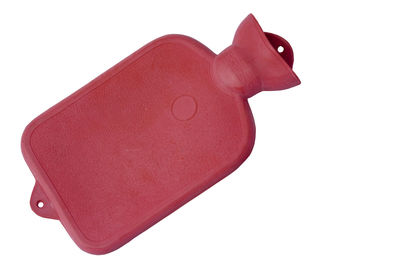 Close-up of red toy against white background