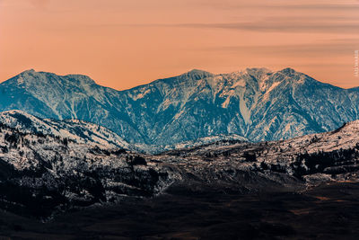 Scenic view of silhouette mountains against sky during sunset