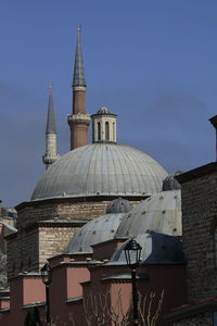 Buildings in city against sky