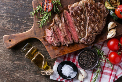 High angle view of meat on cutting board