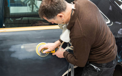 Engineer making car in workshop