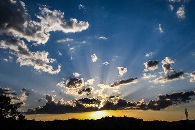 Low angle view of silhouette trees against sky during sunset