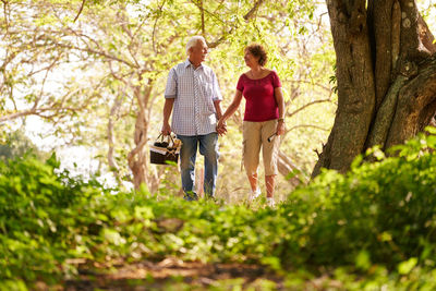 Senior couple walking in forest