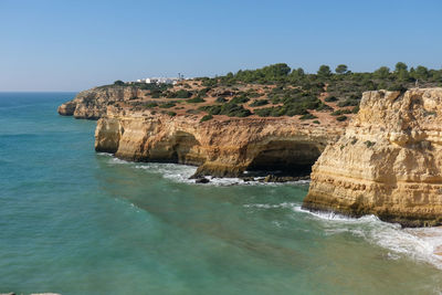 Scenic view of sea against clear blue sky
