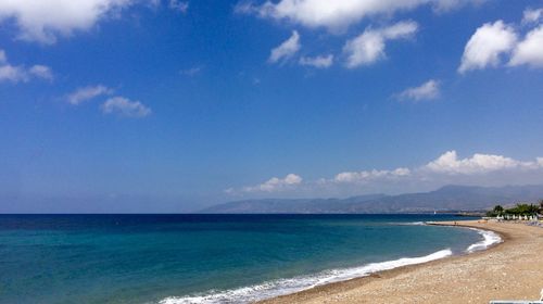Scenic view of sea against cloudy sky